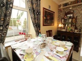 A dining room with a table set for tea at Bruckless Rest Fine Country Dining B&B, Bruckless