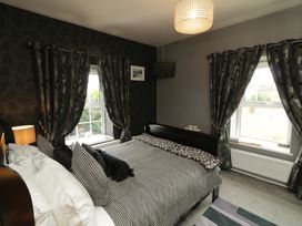 A bedroom with a bed and window at Bruckless Rest Fine Country Dining B&B in Bruckless