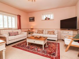 A living room with a sofa and coffee table at Myrtle Cottage in Lynmouth