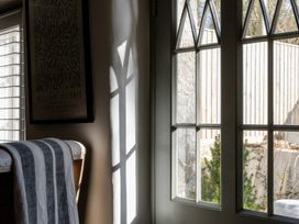 A room with a window and door at Rose Cottage in Gweek