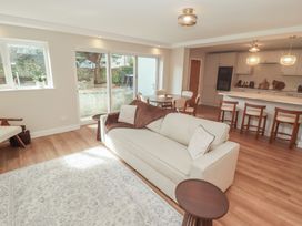 A living room with a sofa and coffee table at Flat 1 in Tenby
