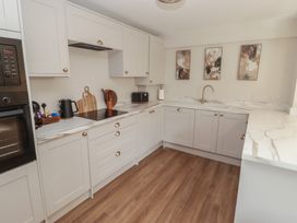 A kitchen with countertop and appliances at Flat 1 Tenby