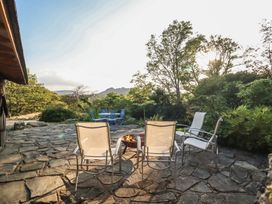 An outdoor seating area with chairs and a fire pit at Waen Fechan in Dolgellau