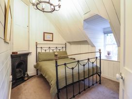 A bedroom with a bed and window at Waen Fechan in Dolgellau