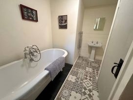 A bathroom with a bathtub and sink at Waen Fechan in Dolgellau