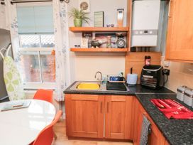 A kitchen with sink and appliances at 1 St. Anns Lane Whitby
