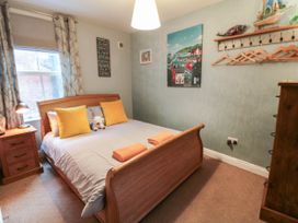 A bedroom with a bed and bedside lamp at 1 St. Anns Lane in Whitby