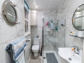 A bathroom with a shower and sink at 1 St. Anns Lane in Whitby