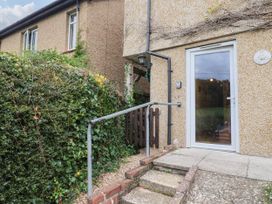 An outdoor entryway with steps and a door at Coombe Cottage Apartment Axmouth