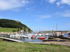 A marina with boats in water at Coombe Cottage Apartment in Axmouth