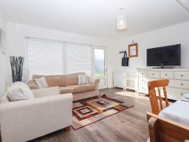 A living room with a sofa and television at 122 Norton Park Dartmouth