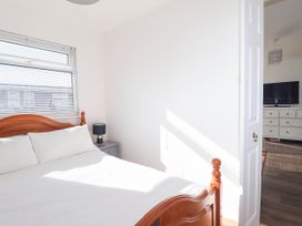 A bedroom with a bed and a nightstand at 122 Norton Park in Dartmouth