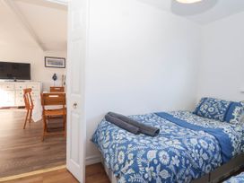 A bedroom with a bed and a TV at 122 Norton Park Dartmouth