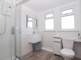 A bathroom with a shower, sink, and toilet at 122 Norton Park in Dartmouth