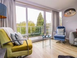 A living room with chairs and a coffee table at 10 Rayrigg Rise Bowness-On-Windermere