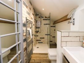 A bathroom with shower, toilet, and sink at 10 Rayrigg Rise Bowness-On-Windermere
