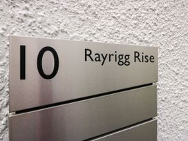 A metal sign displaying the number 10 and Rayrigg Rise