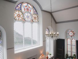 Stained glass windows and chandelier at Chapel of Arts in Criccieth