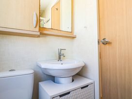 A bathroom with a sink and toilet at No.73 Sennen Cove