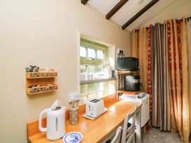 A kitchen with appliances on a table at Kate’s Daingean