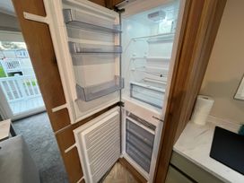 A refrigerator with shelves and a freezer at Cala Gran - The Retreat 256 Boundary Road Fleetwood