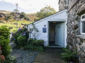 An entrance with a door and plants at 2 High Moss House in Broughton-in-Furness