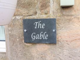 A nameplate on a stone wall at The Gables in Alnwick