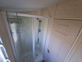 A bathroom with a shower unit at Golden Sands Haven, Sunflower Haven, Mablethorpe