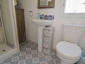 A bathroom with a sink, toilet, and shower at Spruces 30 Sandy Bay, Exmouth