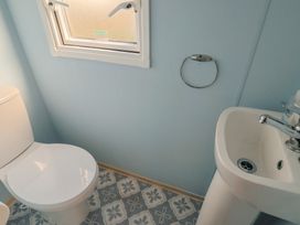 A bathroom with a toilet and sink at Spruces 30 Sandy Bay, Exmouth