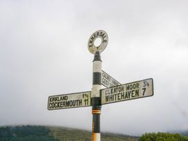 A signpost indicating directions to various locations at Ennerdale in Cleator