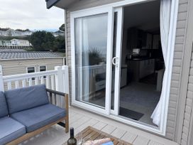An outdoor seating area with a sofa and table at Club Sahara, Sandy Bay, Exmouth