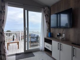 A living room with a view of the sea at Club Sahara Sandy Bay, Exmouth