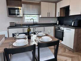 A kitchen with dining table set at Club Sahara, Sandy Bay, Exmouth