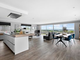A kitchen and living room with a view at Huxham View & Annex Kingsteignton