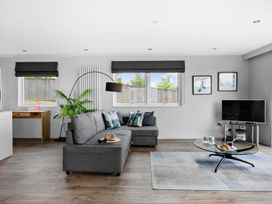 A living room with a sofa and coffee table at Huxham View & Annex in Kingsteignton