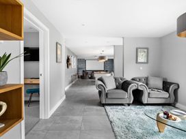 A living room with sofas and a coffee table at Huxham View & Annex in Kingsteignton