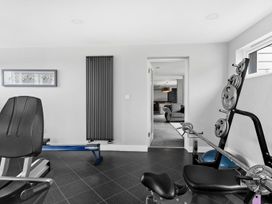 A gym with exercise equipment at Huxham View & Annex in Kingsteignton