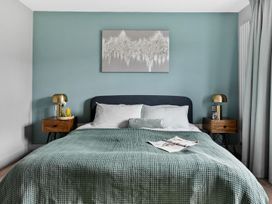 A bedroom with a bed and bedside tables at Huxham View & Annex in Kingsteignton