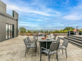 An outdoor dining area with a table and chairs at Huxham View & Annex in Kingsteignton