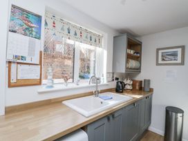 A kitchen with a sink and kettle at Chapel Cottage, Filey