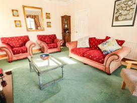 A living room with sofas and a coffee table at Cross Beg in Kilmihil, County Clare