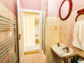 A bathroom with a sink and towel rail at Cross Beg in Kilmihil, County Clare
