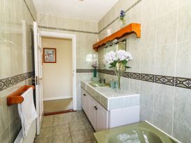 A bathroom with a sink and mirror at Cross Beg Kilmihil, County Clare