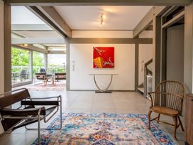 A living room with seating and artwork at Two Hoots Littleworth