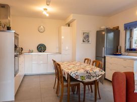 A kitchen with a dining table in Two Hoots Littleworth
