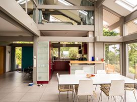 A kitchen with a dining table and chairs at Two Hoots Littleworth