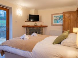 A bedroom with a bed and television at a property in location