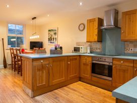 A kitchen with wooden cabinets and appliances at 