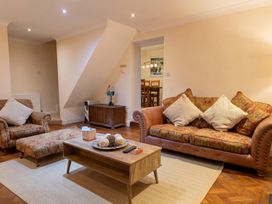 A living room with a sofa and coffee table at The Old Barn in Manchester